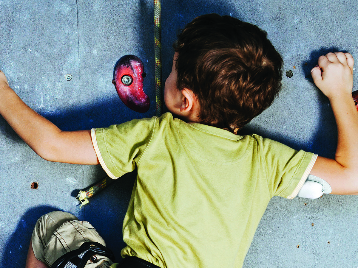 Child climbing a rockwall