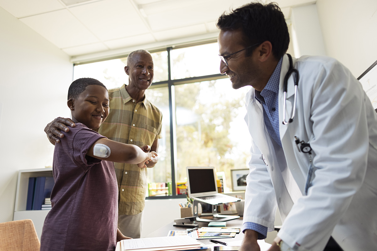 HCP with young podder patient and parent 