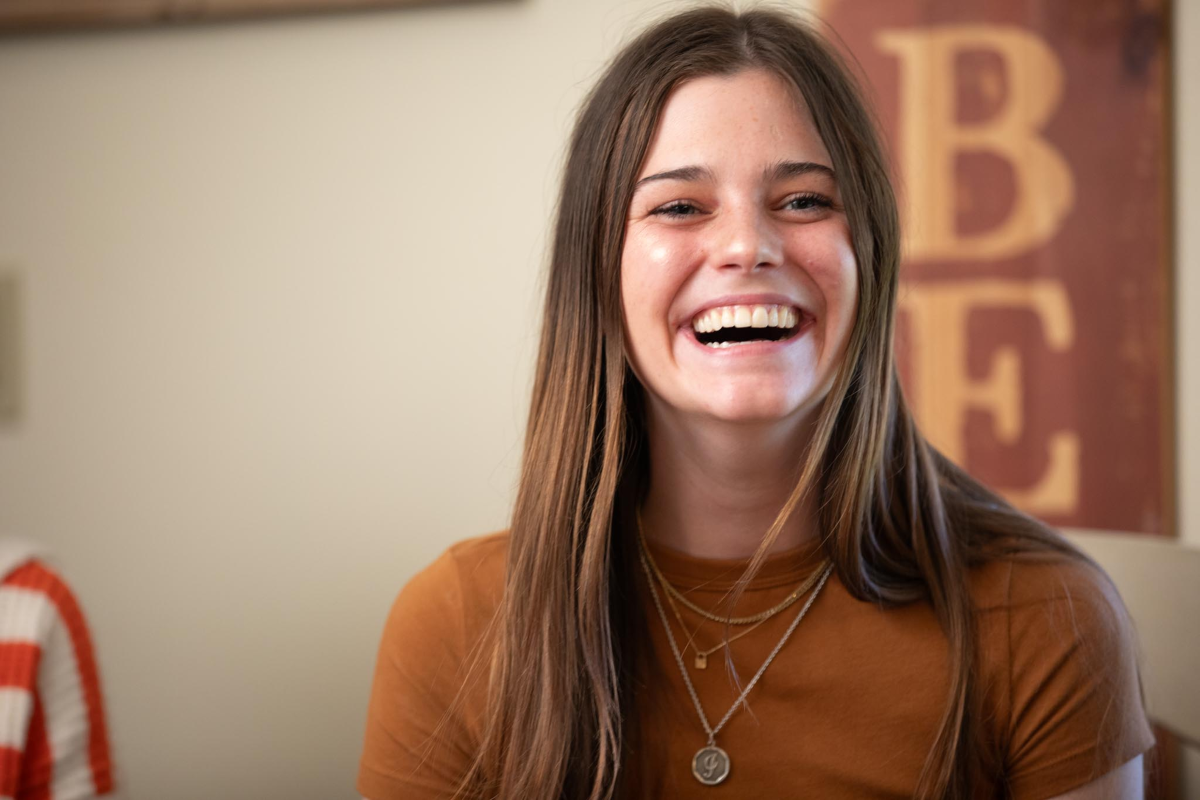 Podder Belle Krueger smiling while giving her testimonial in front of the camera