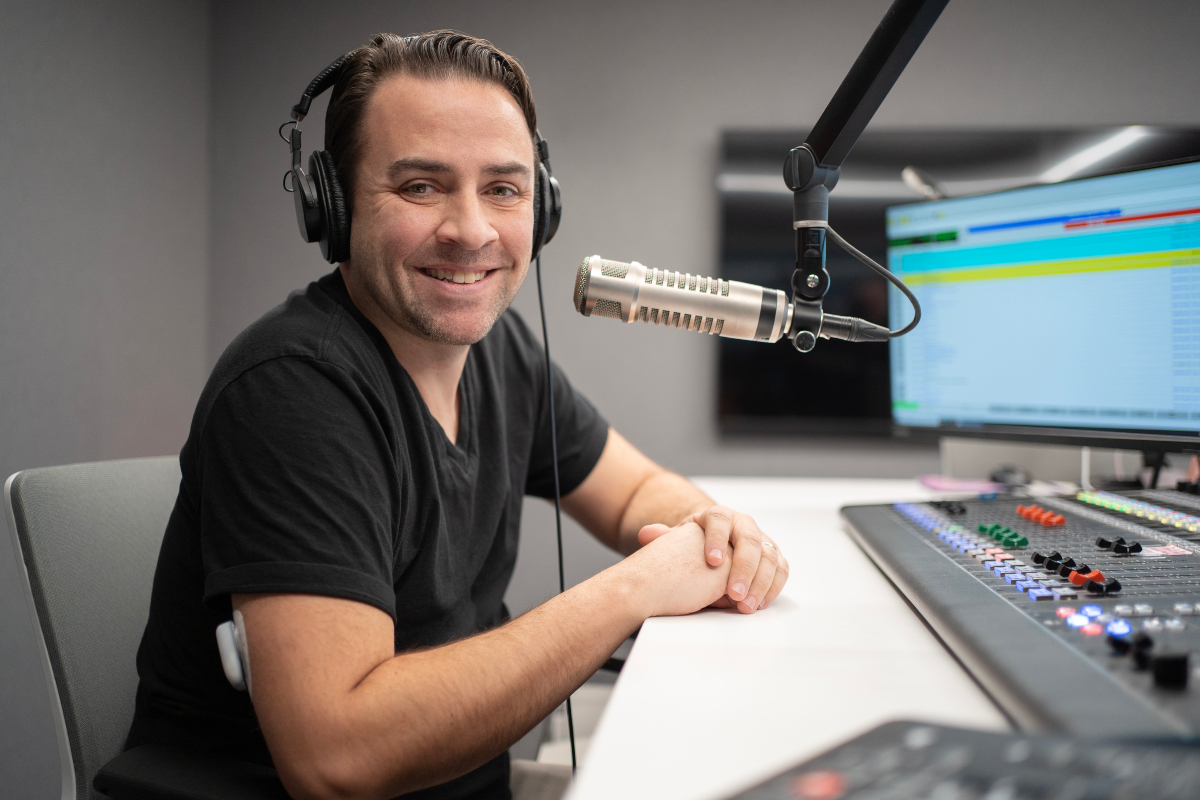 Omnipod Podder Garrett Vogel in studio with headphones on