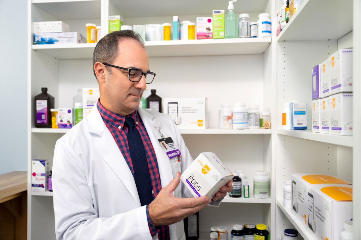 pharmacist reading product label