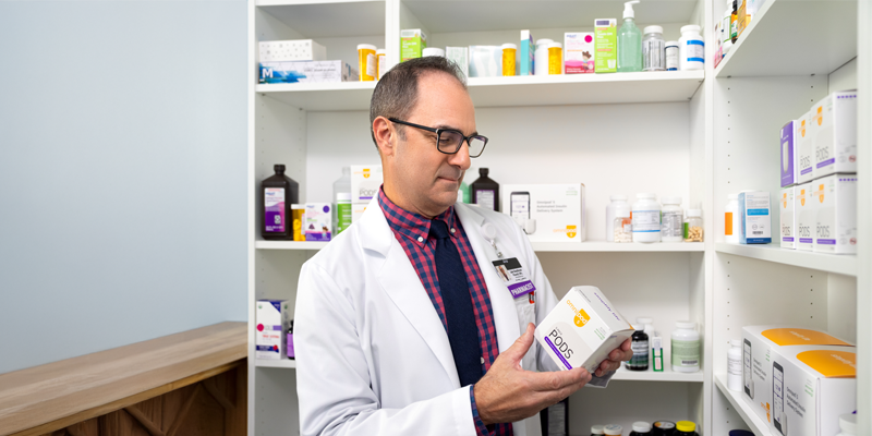 pharmacist reading product label
