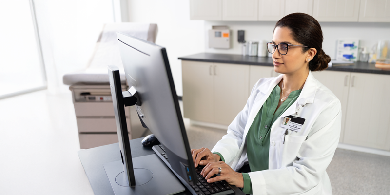 doctor typing at computer