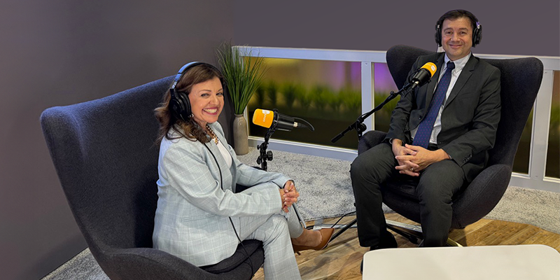 two people in a podcast interview