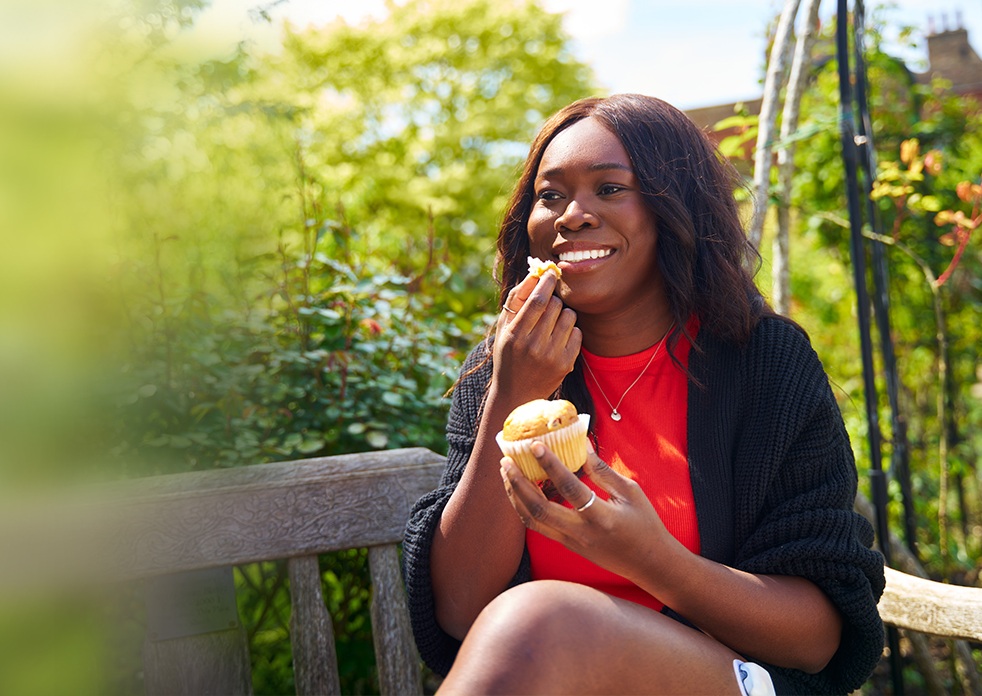 Women eating a cupcake while using an insulin pump