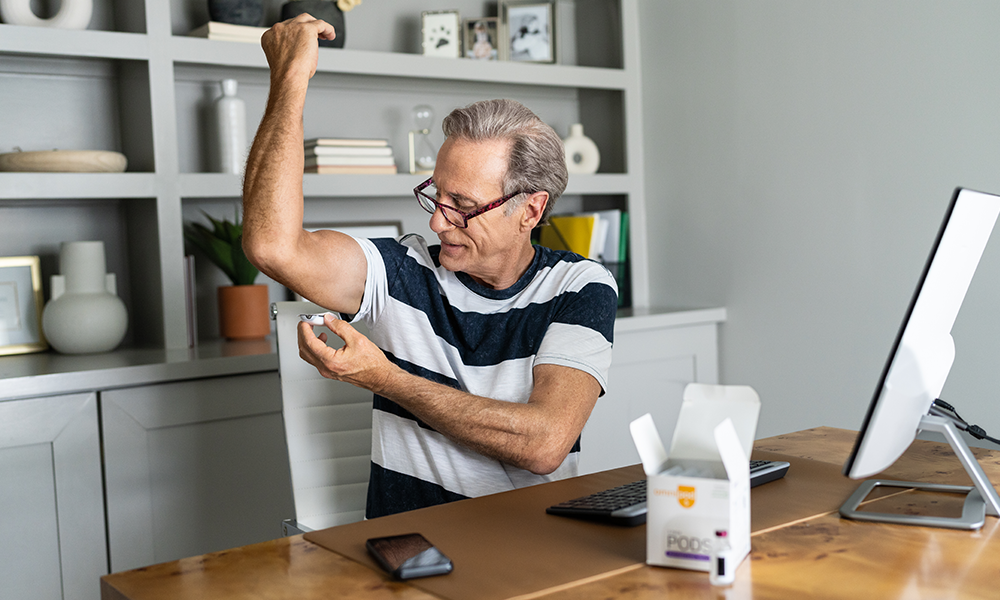 A patient putting pod on arm