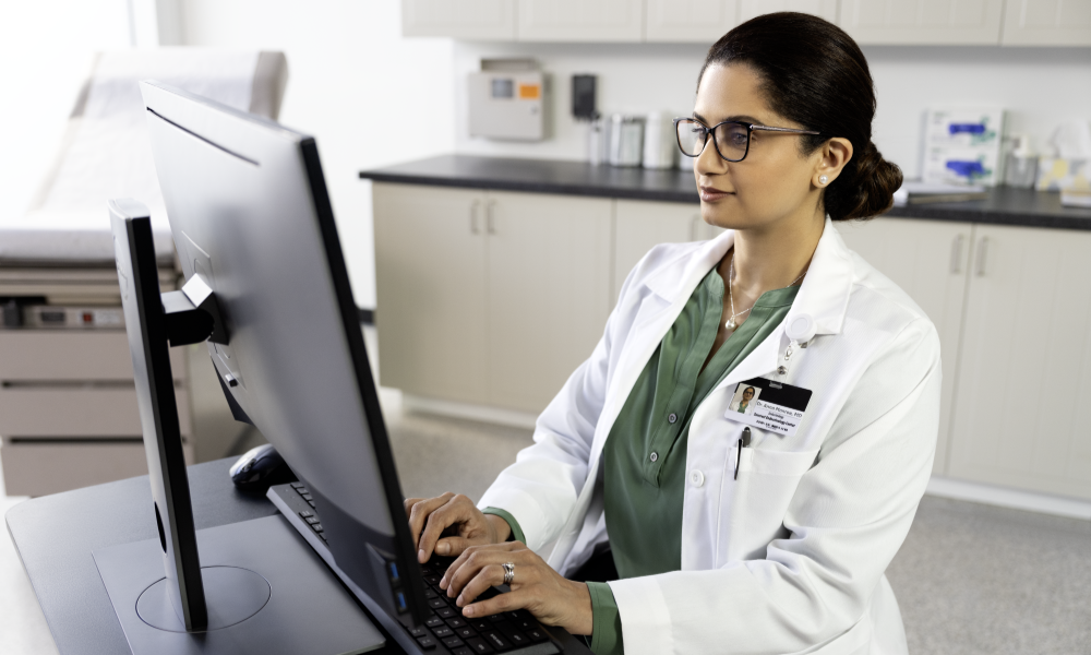 Healthcare professional sitting at the computer