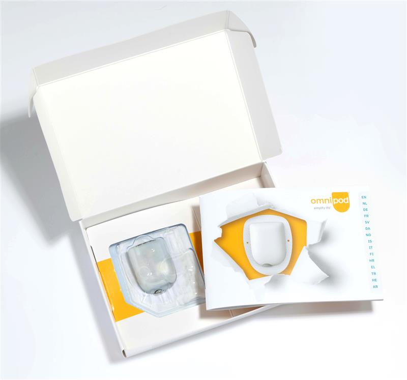 Omnipod box open with Omnipod and manual inside