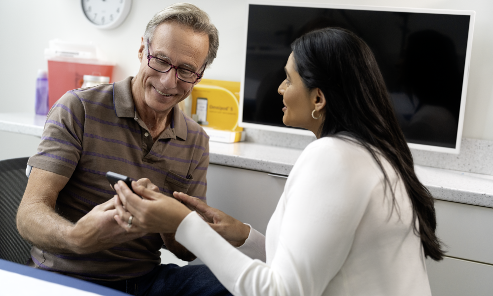 Two people looking at a phone together