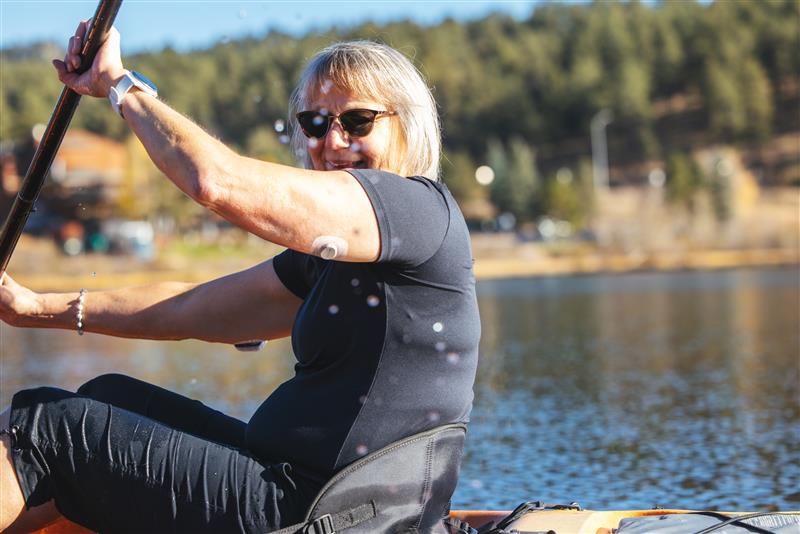 woman kayaking on a lake