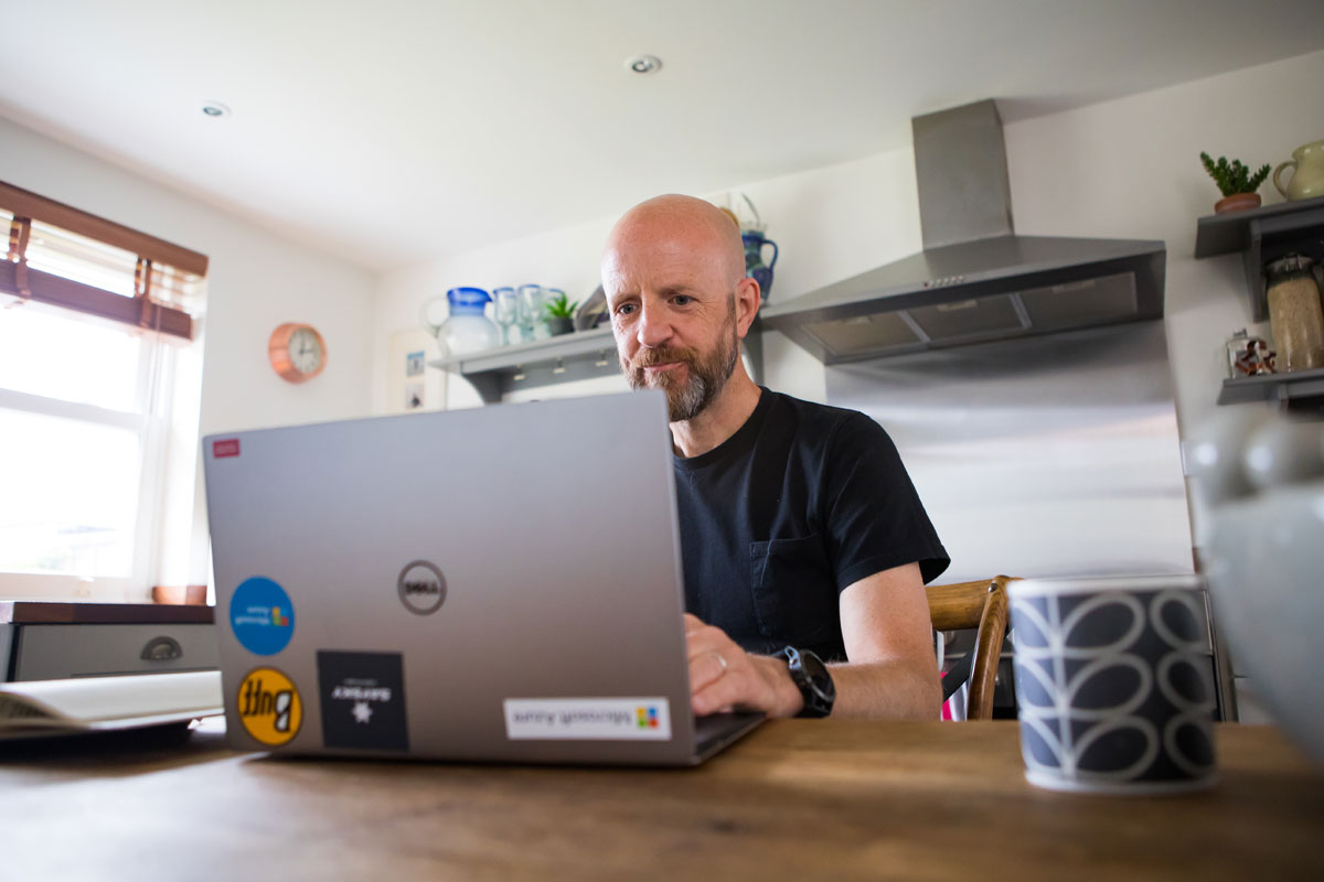 Podder Marcus Bosano typing on laptop