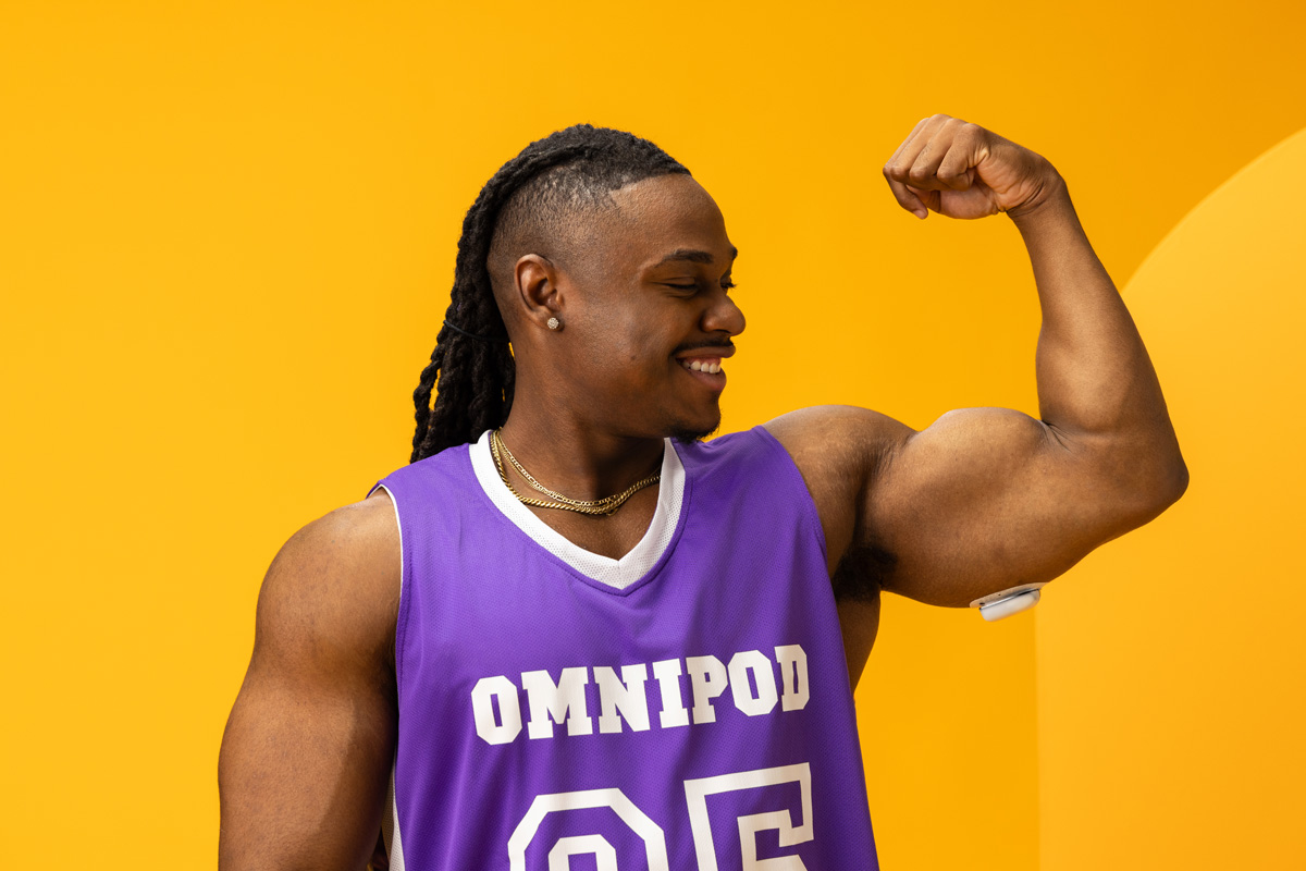 man wearing a Pod on his arm flexing his arm muscle