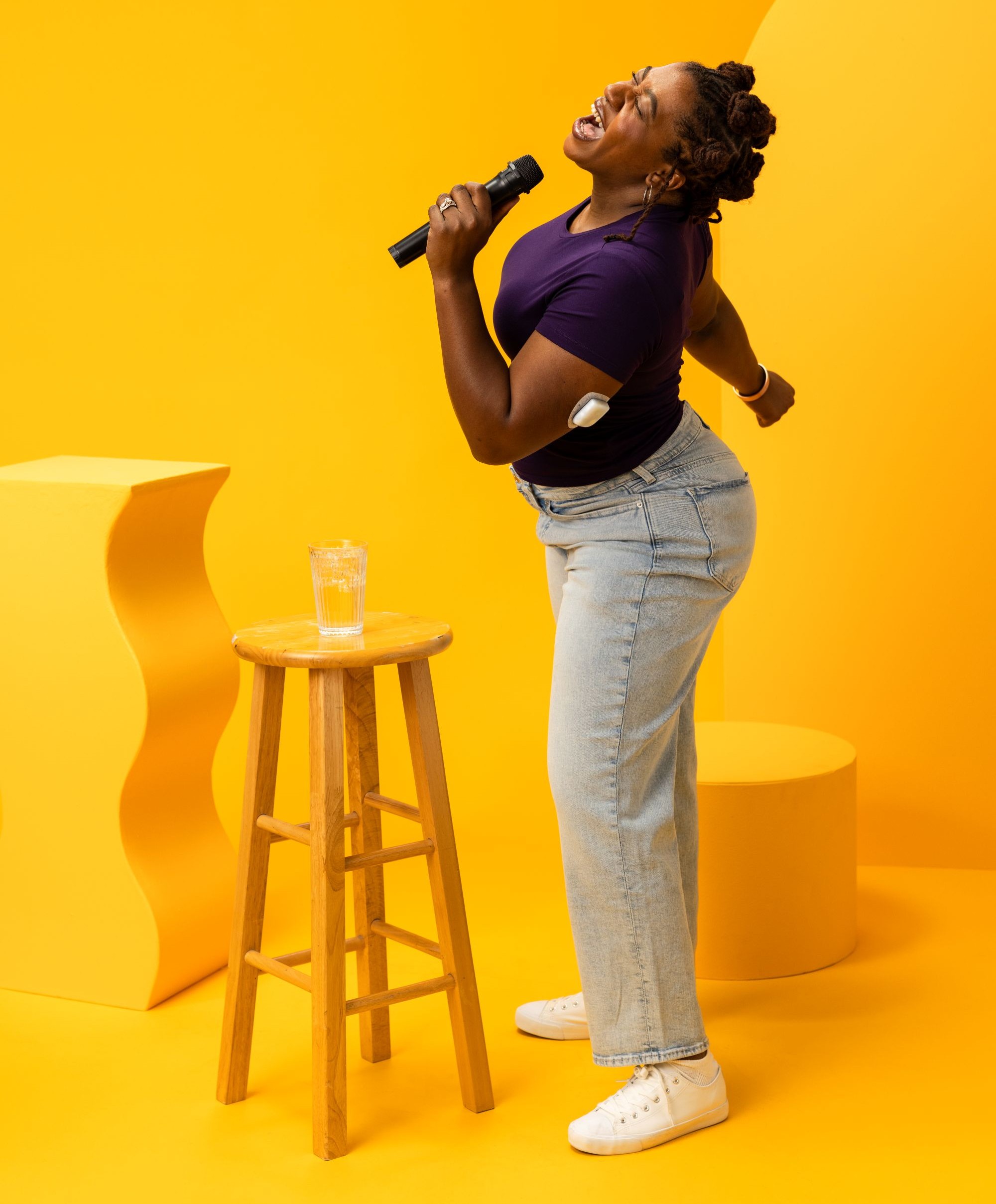 Podder, wearing an Omnipod, singing into a microphone