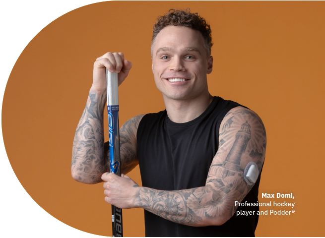 Podder Max, holding a hockey stick