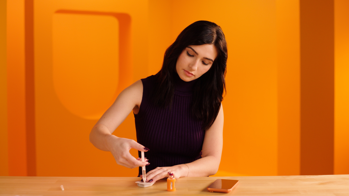 Person filling a an Omnipod Pod with insulin