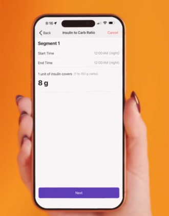 A person's hand holding up Omnipod 5 on an iPhone showing the steps for mealtime