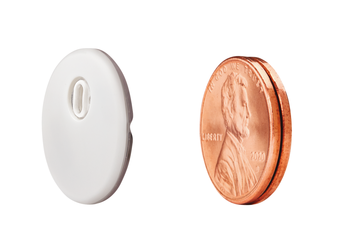 FSL3 next to two stacked pennies, showing the FSL3 to be smaller
