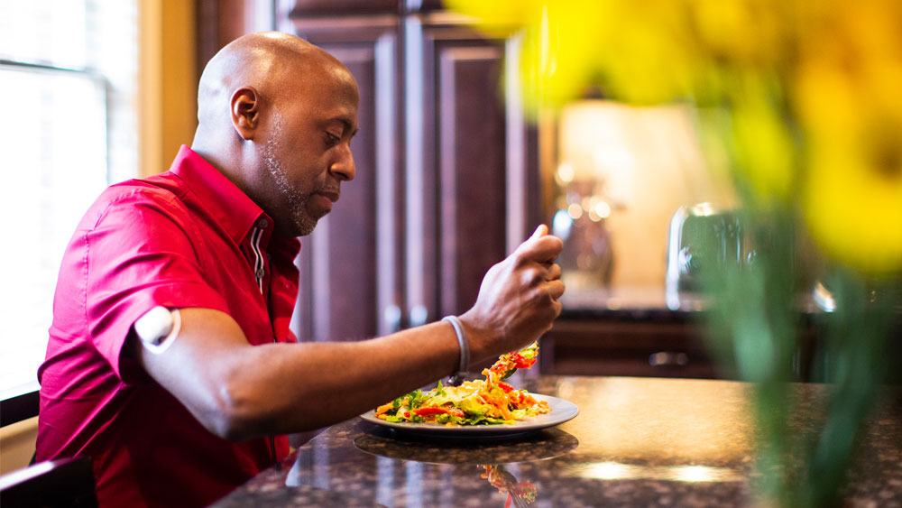 man eating at a restaurant