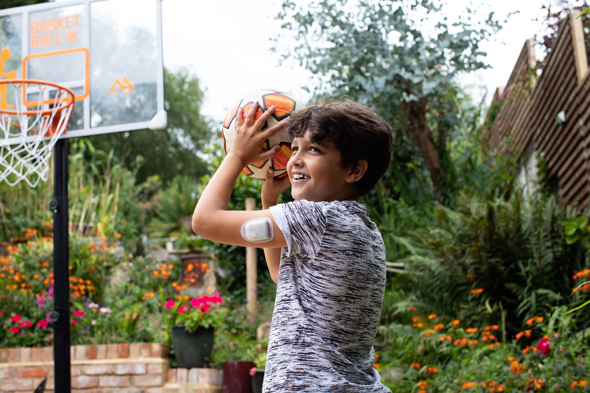 a boy playing with a soccer ball
