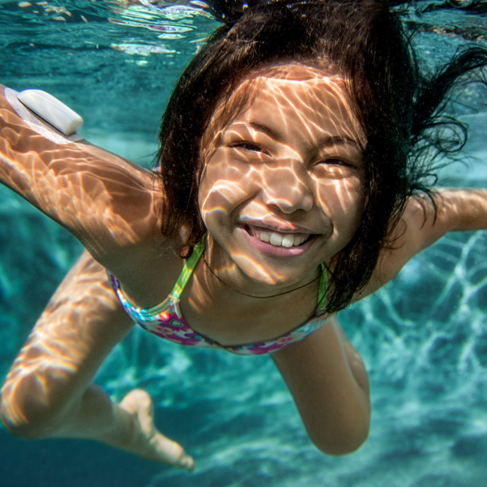 child swimming underwater