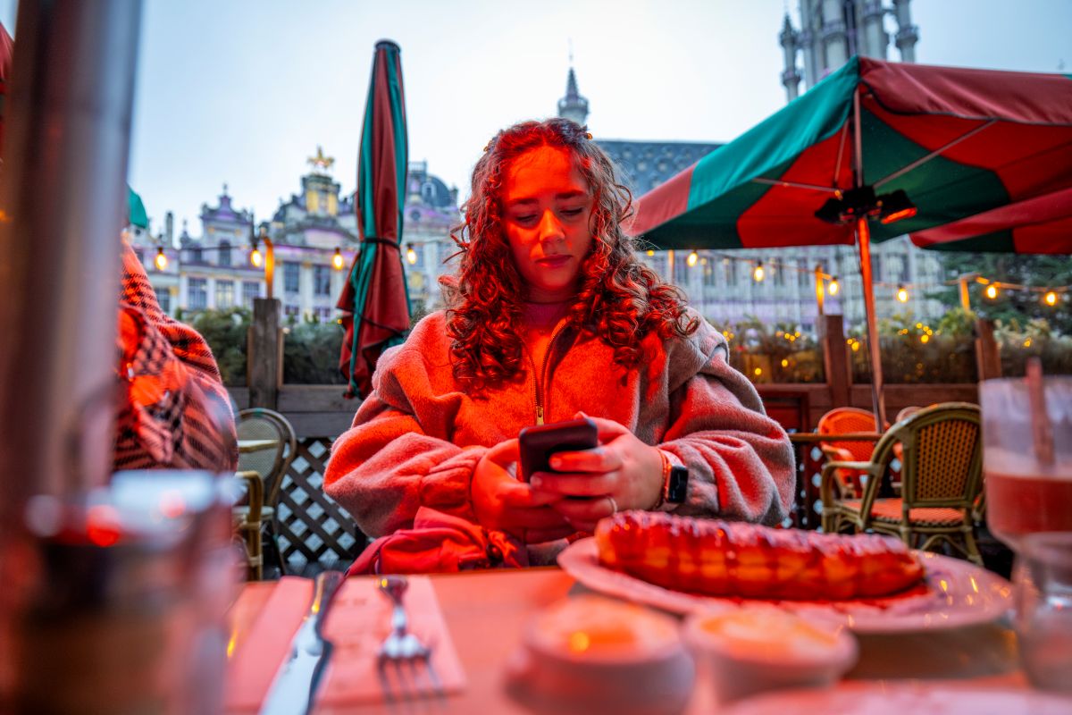 Podder, Chloe, sitting at a restaurant