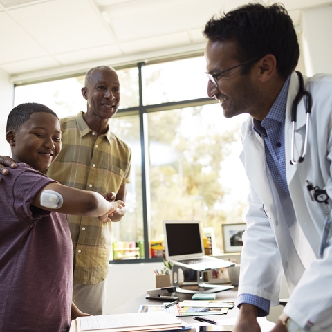 HCP with young podder patient and parent