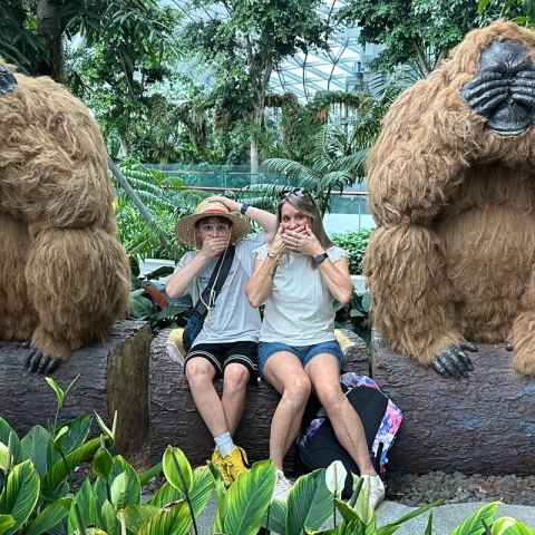 mom and child with large gorilla figures
