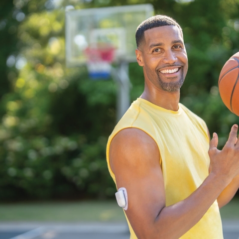 man tossing a basketball