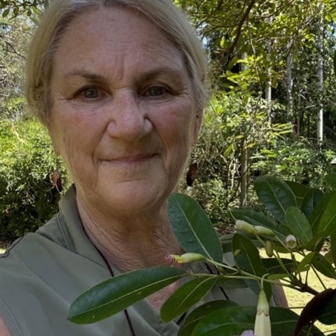 woman in a garden holding
